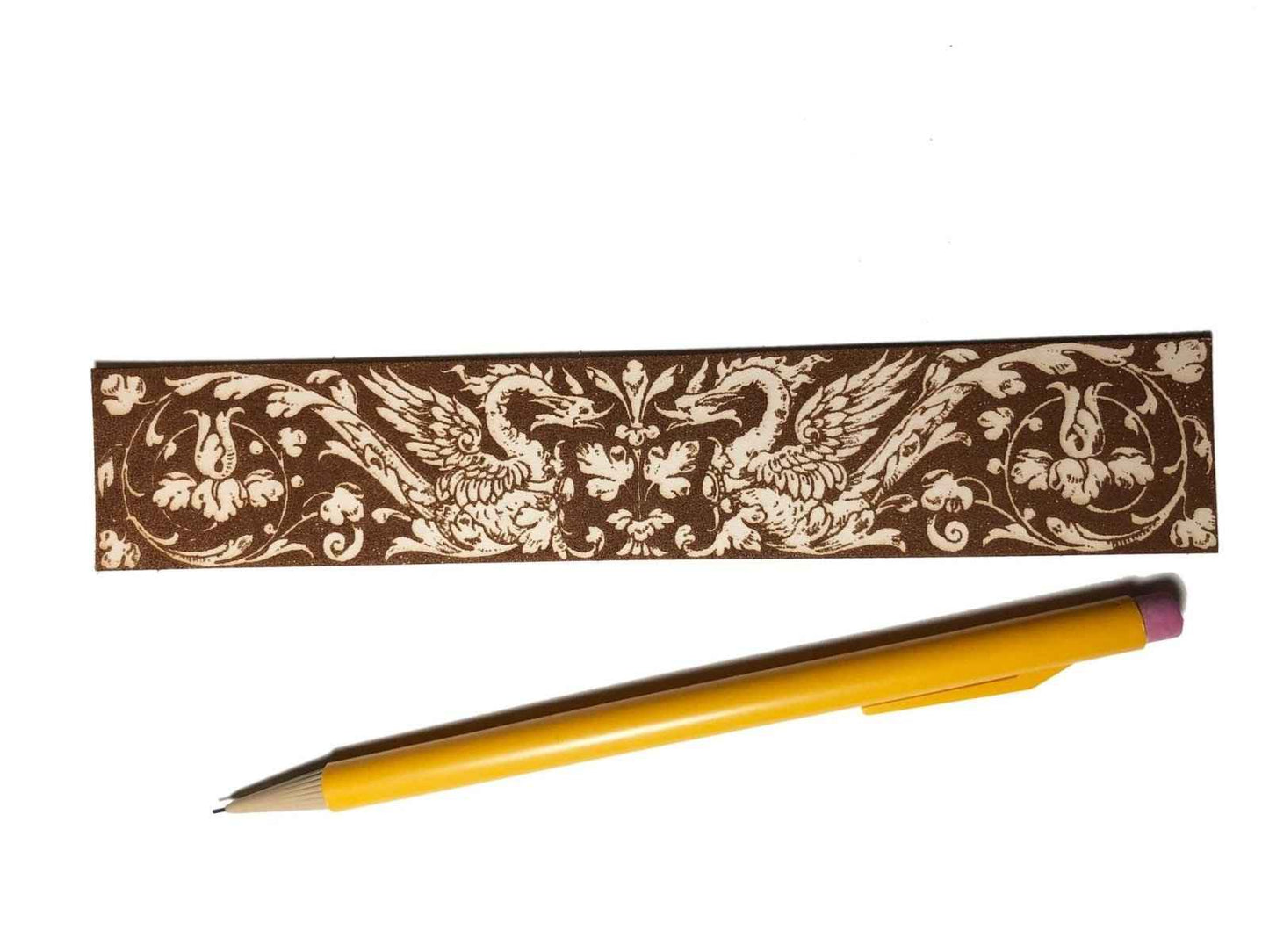Medieval Swans Bookmark next to a pencil for scale. Medieval Swans Bookmark Bookmarks Raven King Crafts