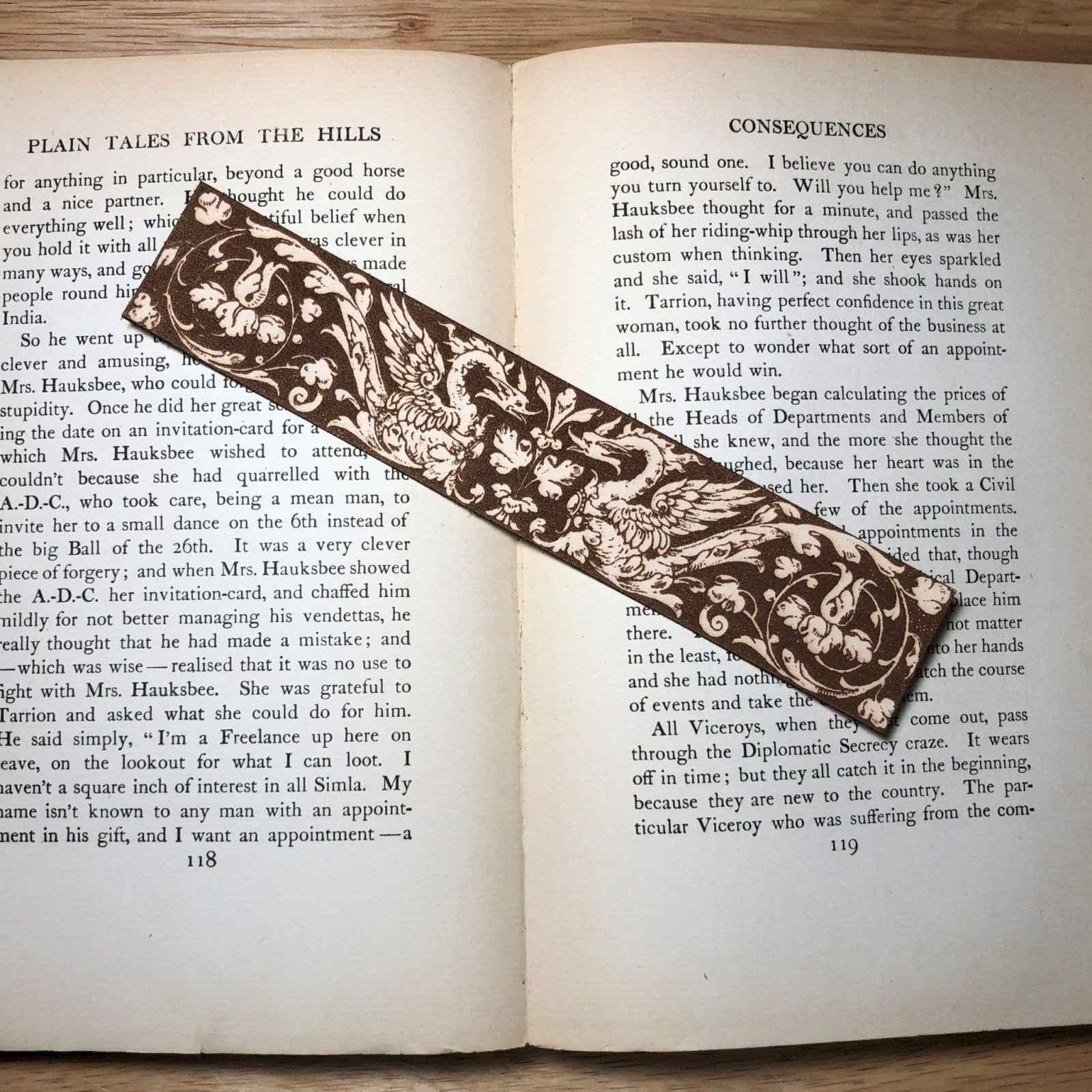 A leather bookmark engraved with the antique art of sdome medieval swans on it. Medieval Swans Bookmark Bookmarks Raven King Crafts