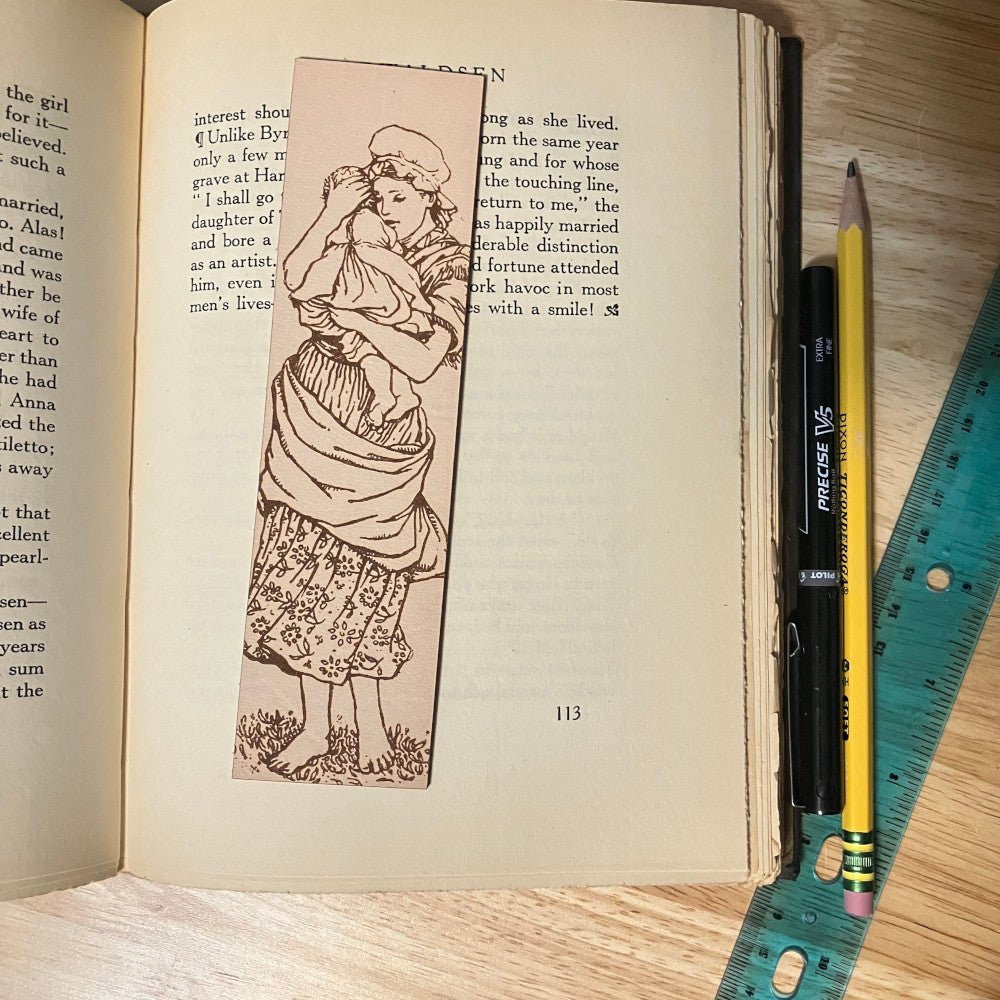 A rectangular shaped leather bookmark. The Mother is waring a dress with flowers at the bottom and is barefoot.