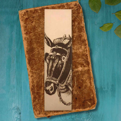 A leather bookmark engraved with the antique art of a mule on it. Mule Bookmark Bookmarks Raven King Crafts