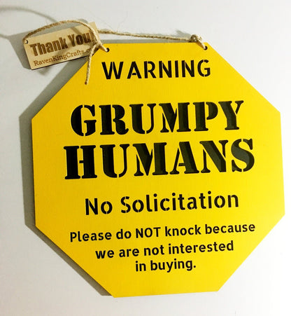 A large yellow sign : WARNING GRUMP HUMANS No Solicitation Please do NOT knock because we are not interested in buying.