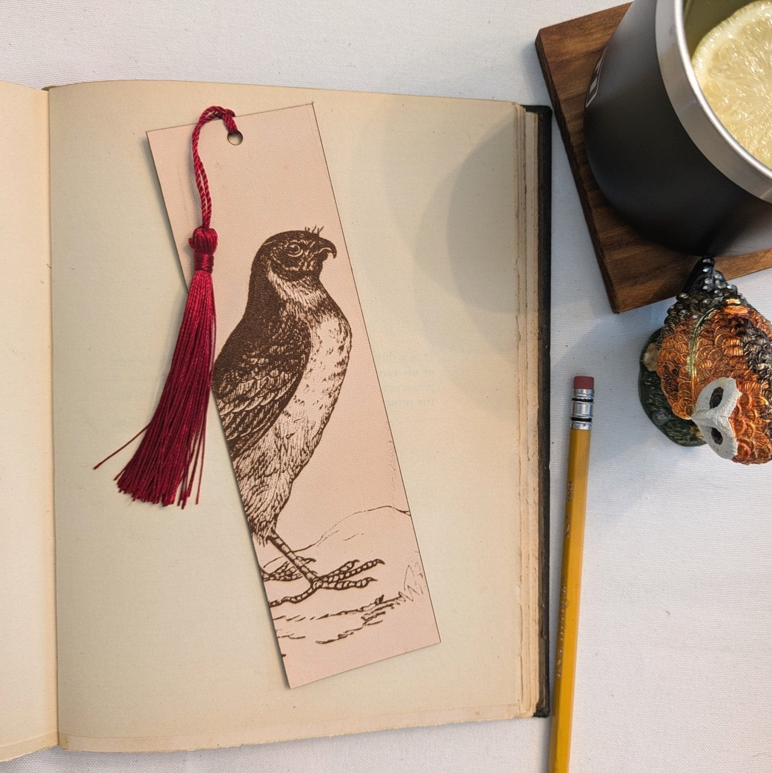 A leather bookmark engraved with the antique art of a marsh hawk, also called a northern harrier. Northern Harrier Bird Bookmark - Leather Bookmarks Raven King Crafts