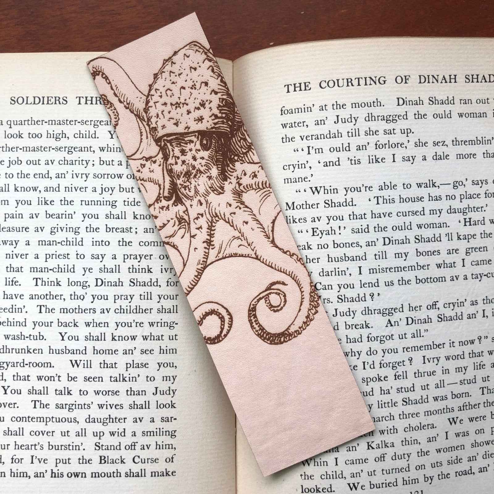 A leather bookmark engraved with the art of an octopus on it. Octopus Bookmark Bookmarks Raven King Crafts