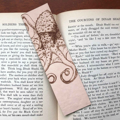A leather bookmark engraved with the art of an octopus on it. Octopus Bookmark Bookmarks Raven King Crafts