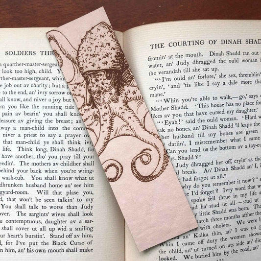 A leather bookmark engraved with the art of an octopus on it. Octopus Bookmark Bookmarks Raven King Crafts