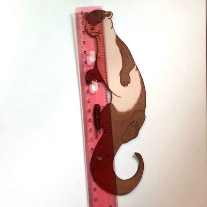 A cute otter bookmark next to a ruler for scale. Otter Bookmark Bookmarks Raven King Crafts