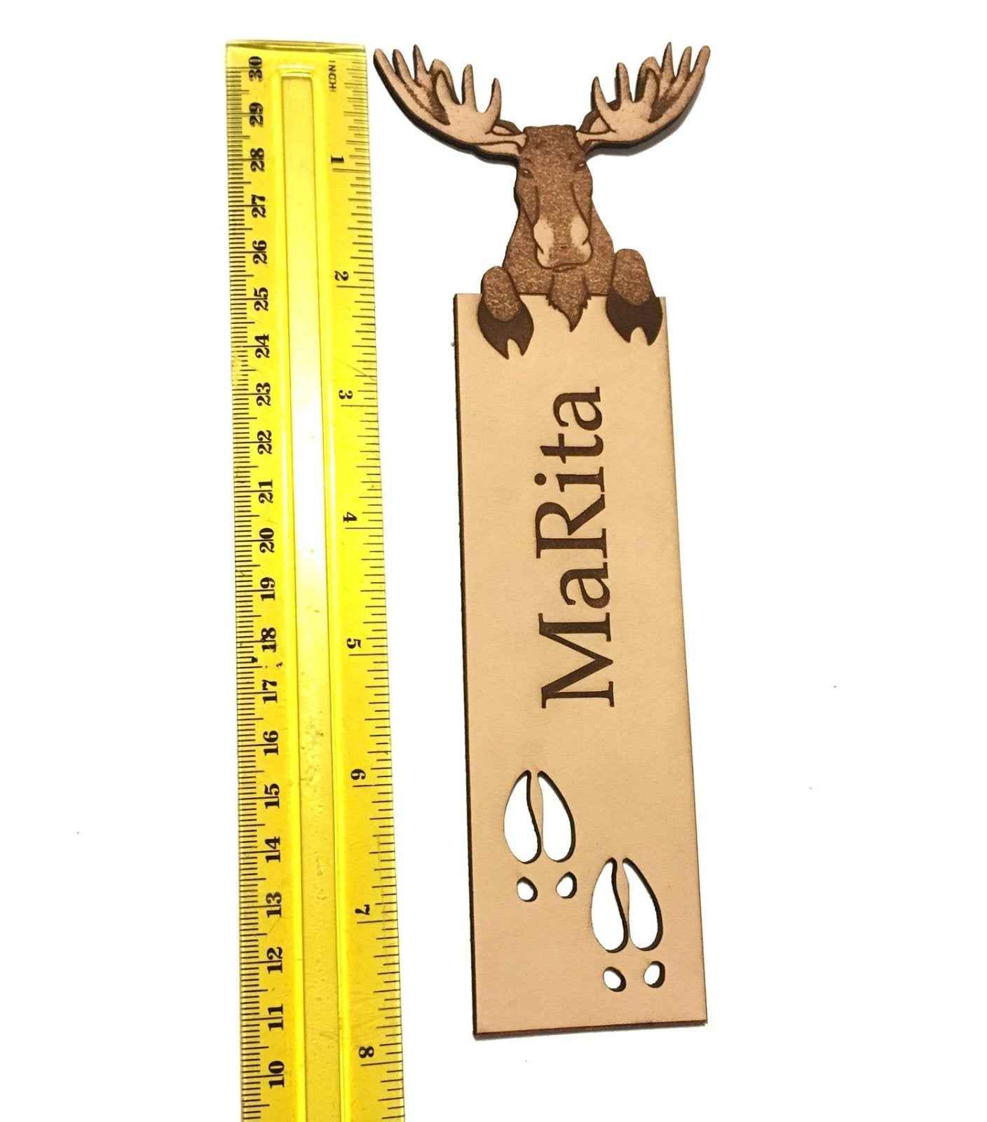A photograph of exclusive personalizable moose leather bookmark next to a ruler for scale. Personalizable Moose Leather Bookmark - Unique Gift for Book Lovers Bookmarks Raven King Crafts