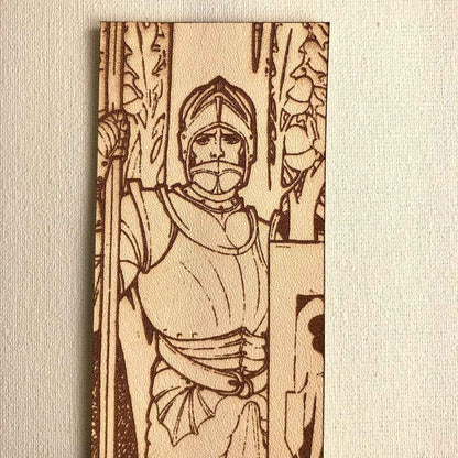 A leather bookmark with the antique art of a knight wearing plate armor engraved on it. Plate Armored Knight Leather Bookmark Bookmarks Raven King Crafts