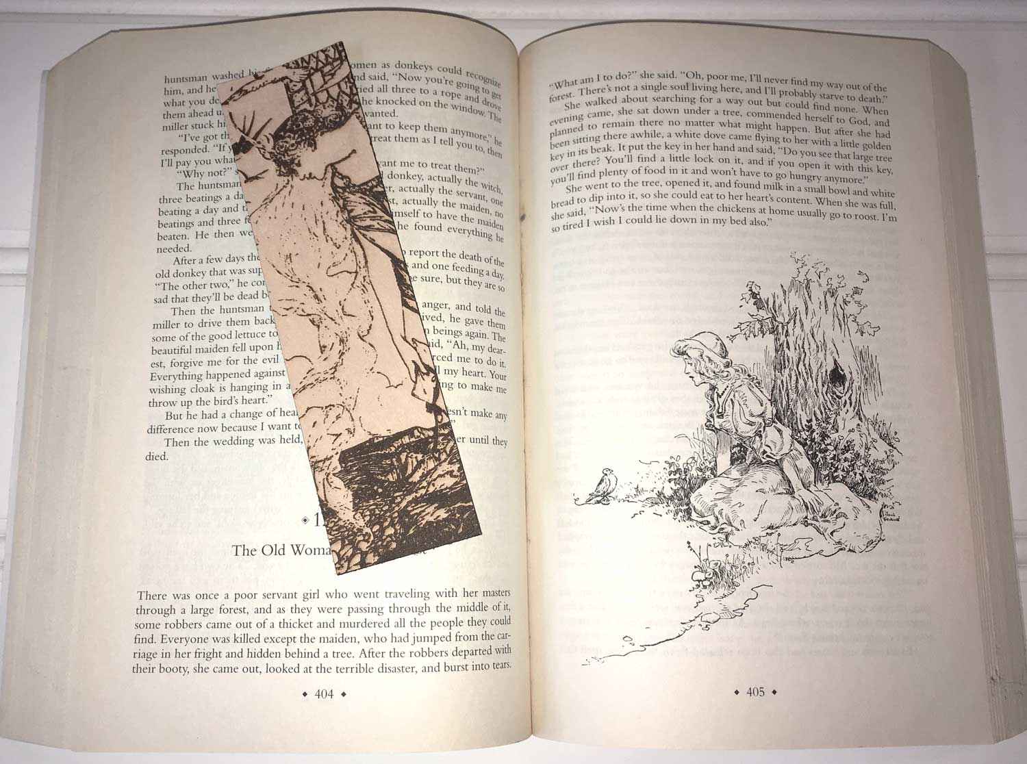A leather bookmark with the antique art of a Princess Leaning Out The Tower on it. Princess Leaning Out The Tower Bookmark Bookmarks Raven King Crafts