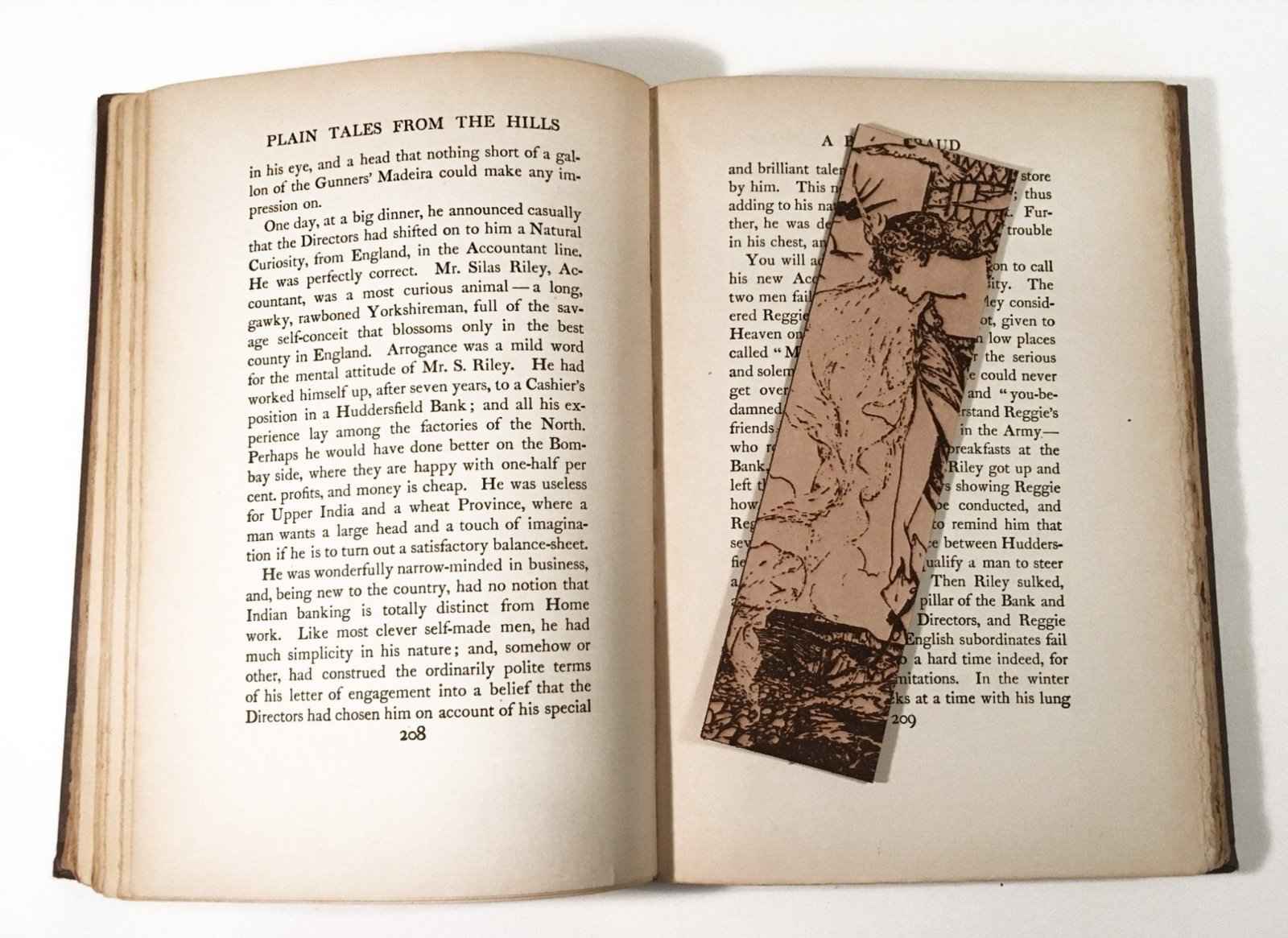 A leather bookmark with the antique art of a Princess Leaning Out The Tower on it. Princess Leaning Out The Tower Bookmark Bookmarks Raven King Crafts