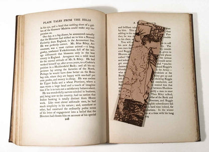 A leather bookmark with the antique art of a Princess Leaning Out The Tower on it. Princess Leaning Out The Tower Bookmark Bookmarks Raven King Crafts