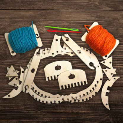 A picture of our fun Halloween themed look it, including pumpkin looms, jack-o-latern pieces, yarn and a shuttle. Pumpkin Themed Loom Craft Kit Art & Crafting Materials Raven King Crafts