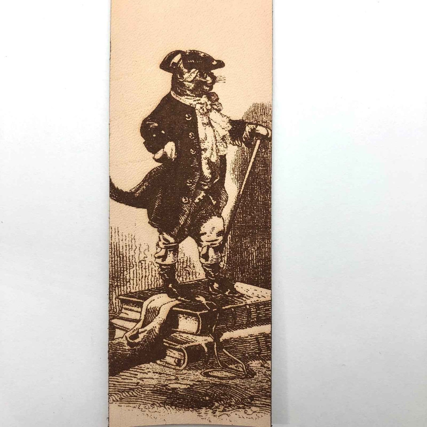 A leather bookmark with the antique art of Puss in Boots Bookmark on it. Puss in Boots Bookmark Bookmarks Raven King Crafts