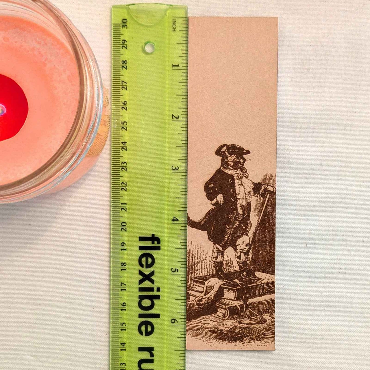 A leather bookmark with the antique art of Puss in Boots Bookmark on it. Puss in Boots Bookmark Bookmarks Raven King Crafts