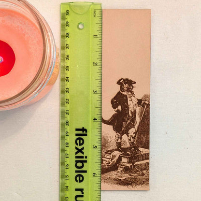A leather bookmark with the antique art of Puss in Boots Bookmark on it. Puss in Boots Bookmark Bookmarks Raven King Crafts