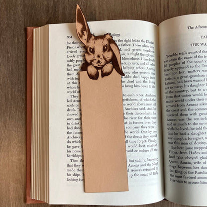 The blank bunny bookmark resting on the pages of an open book.