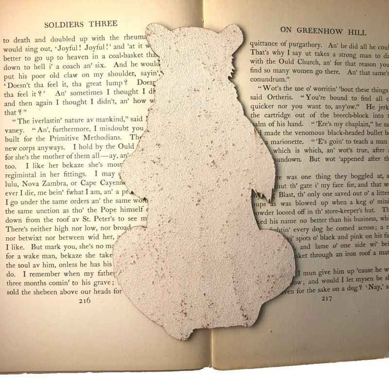 The backs of the leather bookmarks are unfinished and you can see the leather grain. Reading Bear with a Mug - Leather Bookmark Bookmarks Raven King Crafts