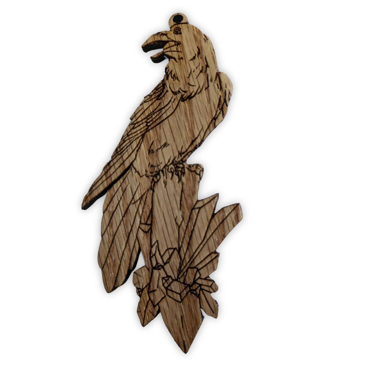 Photograph of the red oak wooden raven ornament. 