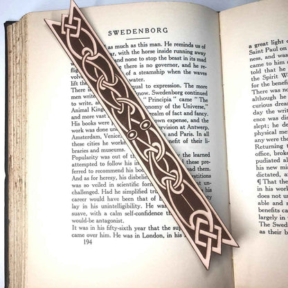 A leather bookmark with the antique art of Celtic ribbon on it. Ribbon Shaped Celtic Bookmark - Leather Bookmarks Raven King Crafts