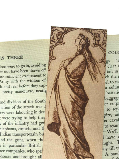 A leather bookmark with the antique art of a beautiful woman in prayer on it. Robed Woman Facing the Heavens Bookmark Bookmarks Raven King Crafts
