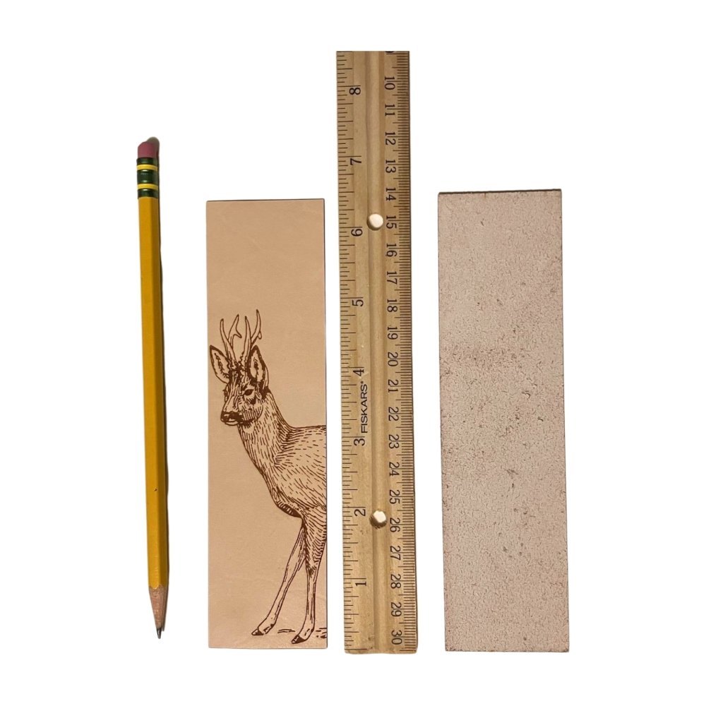 A photograph of the front of the leather bookmark and the back. The bookmarks are next to a ruler and a pencil for scale. Back photo shows the bookmark back is unfinished.