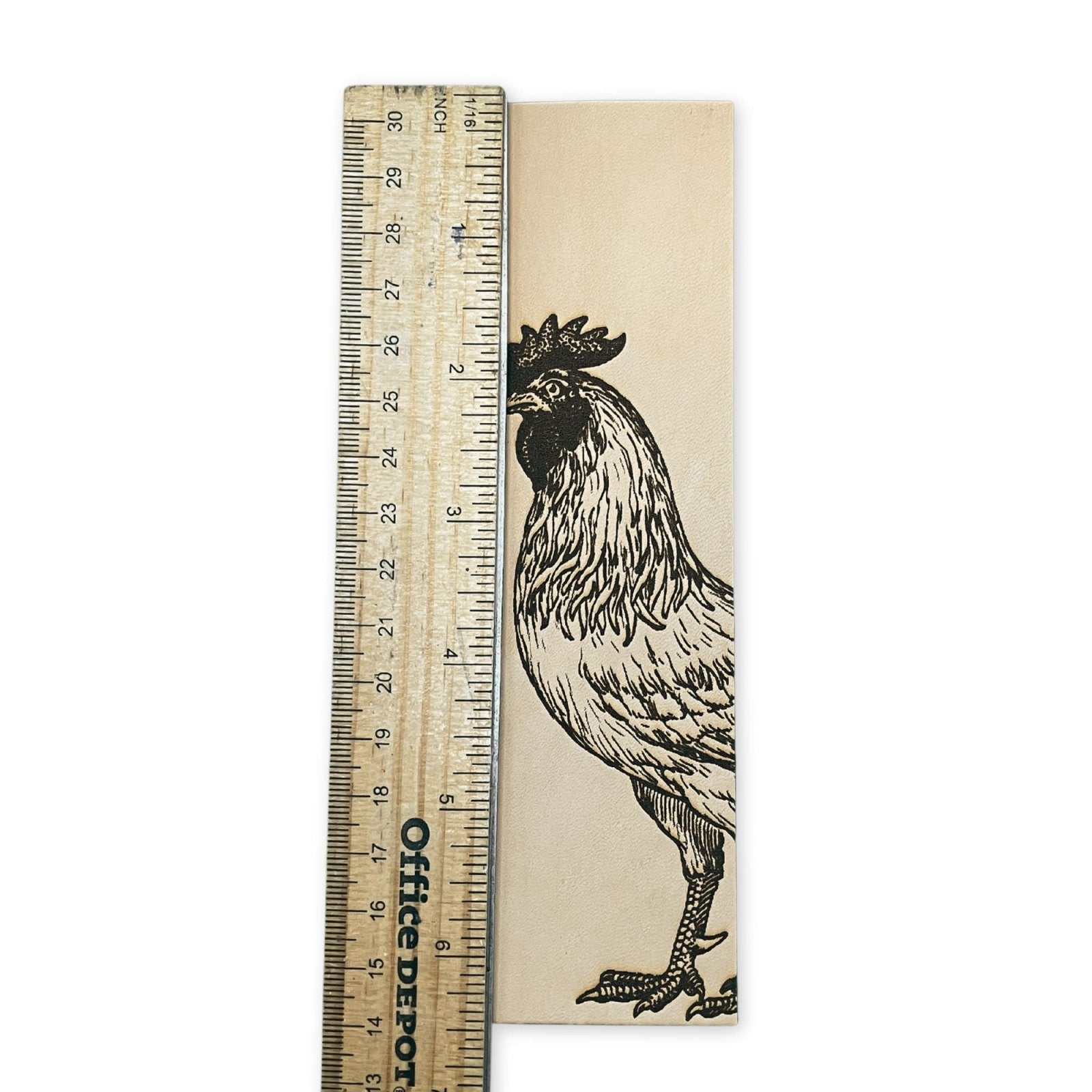The rooster bookmark next to a ruler for scale. Rooster Bookmark - Leather Bookmarks Raven King Crafts