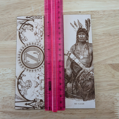 Big Eagle bookmark and Wizard of Oz bookmark next to a ruler for scale. 