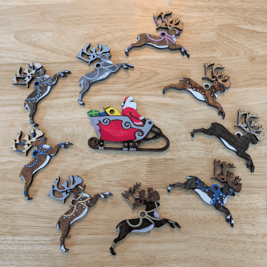 Example of the ornaments finished with marker and paint, they can be hung individually as ornaments or strung together. Santa and his reindeer ornament or garland blanks - 9 Deer, wooden Art & Craft Kits Raven King Crafts