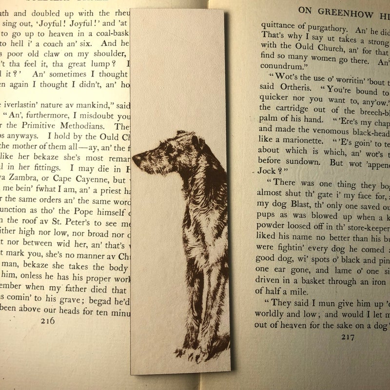 A leather rectangle shaped bookmark with a Scottish Deerhound dog engraved on it.