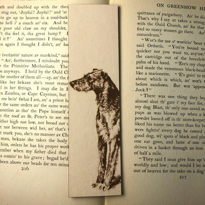 A leather rectangle shaped bookmark with a Scottish Deerhound dog engraved on it.