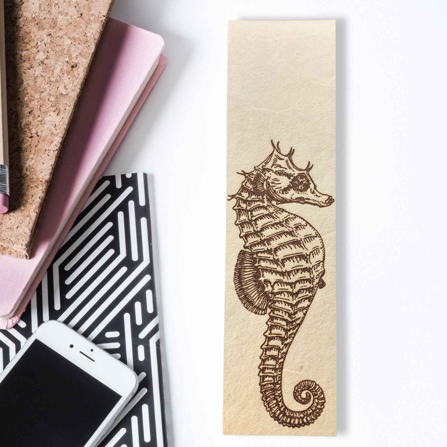 A leather bookmark with the antique art of a seahorse engraved on it. Seahorse Bookmark Bookmarks Raven King Crafts