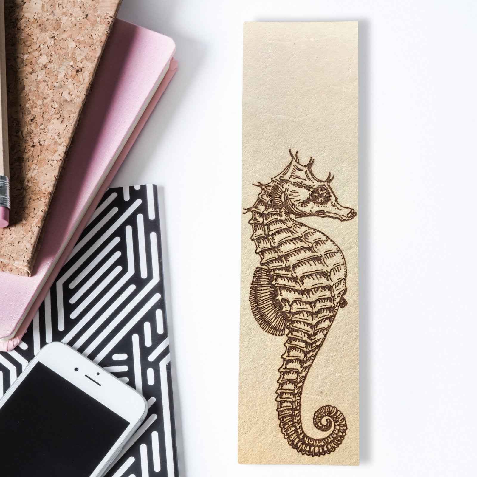 A leather bookmark with the antique art of a seahorse engraved on it. Seahorse Bookmark Bookmarks Raven King Crafts