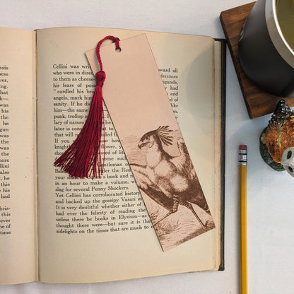 A leather bookmark with the antique art of a secretary bird engraved on it. Secretary Bird Bookmark - Leather Bookmarks Raven King Crafts