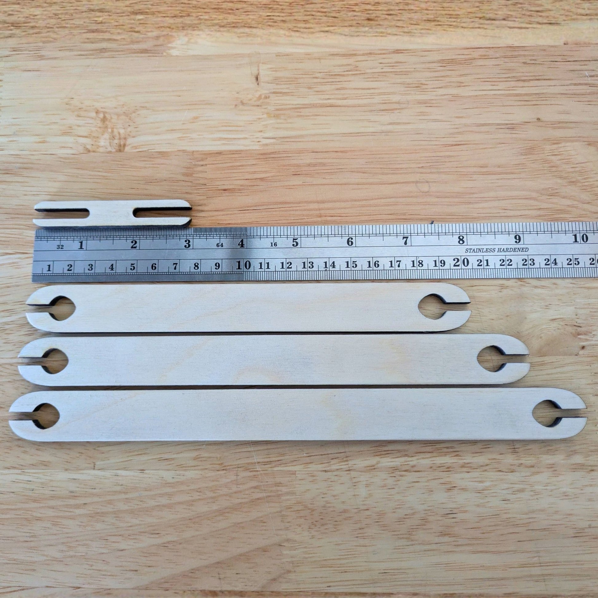 The shuttles next to a ruler to show the length of the shuttles. 