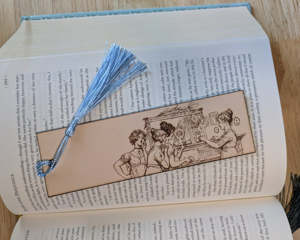 A leather bookmark engraved with the art of the Bennet sister from Pride and Prejudice.