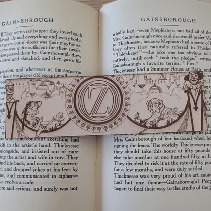 A leather bookmark engraved with art from the Wizard of OZ bookmarks. Wizard of Oz Bookmark Bookmarks Raven King Crafts