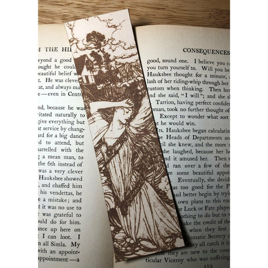 A leather bookmark of a long haired, robed woman standing with her arm resting against her forehead.