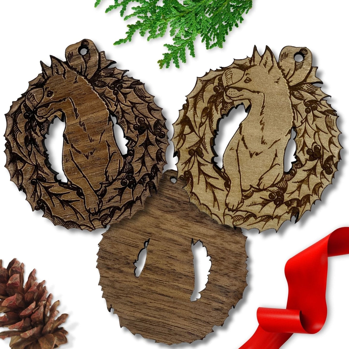 The wooden fox ornaments in this picture show the dark and the light wood varieties. It also shows the back of the ornament is not engraved with the design. Wood Fox Ornaments Ornament Raven King Crafts