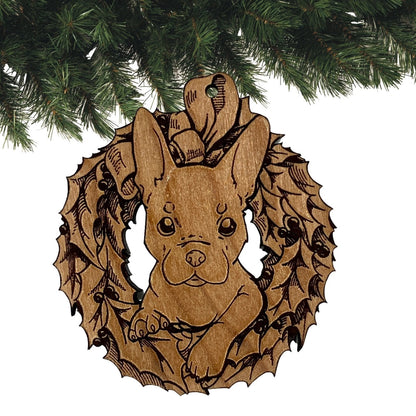 The reddish variety of the French Bulldog ornament. This wooden ornament shows a puppy's head sticking out of a Christmas wreath engraved on it. The ornament is then sanded and given a clear glossy coat to protect the wood. Wood French Bulldog Ornaments Ornament Raven King Crafts