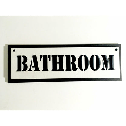 A black and white plywood sign that says bathroom.