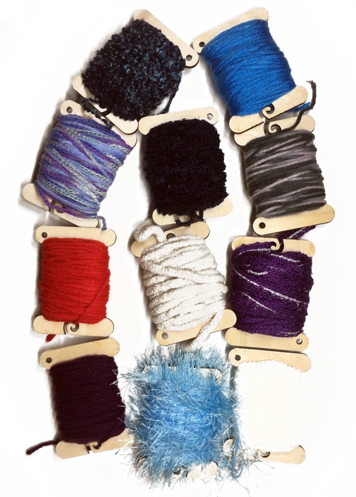 Examples of how the wood spools look with yarn on them. Wooden Bobbins / Spools - 3 Packs Art & Crafting Materials Raven King Crafts