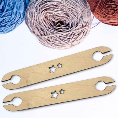 A picture of our wooden shuttles for weaving, each shuttle is cut by us and hand sanded. Wooden Weaving Shuttle for Looms - 2 Pack Art & Crafting Materials Raven King Crafts