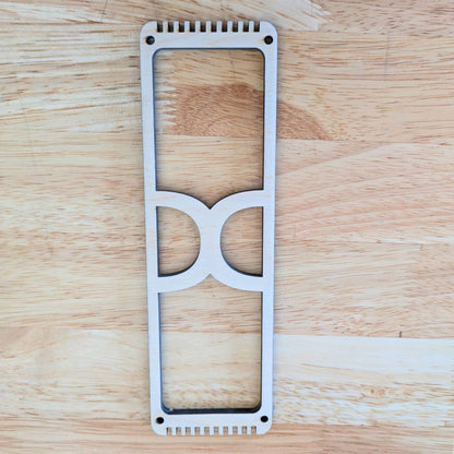 A wooden frame loom that is designed for weaving bookmarks. 